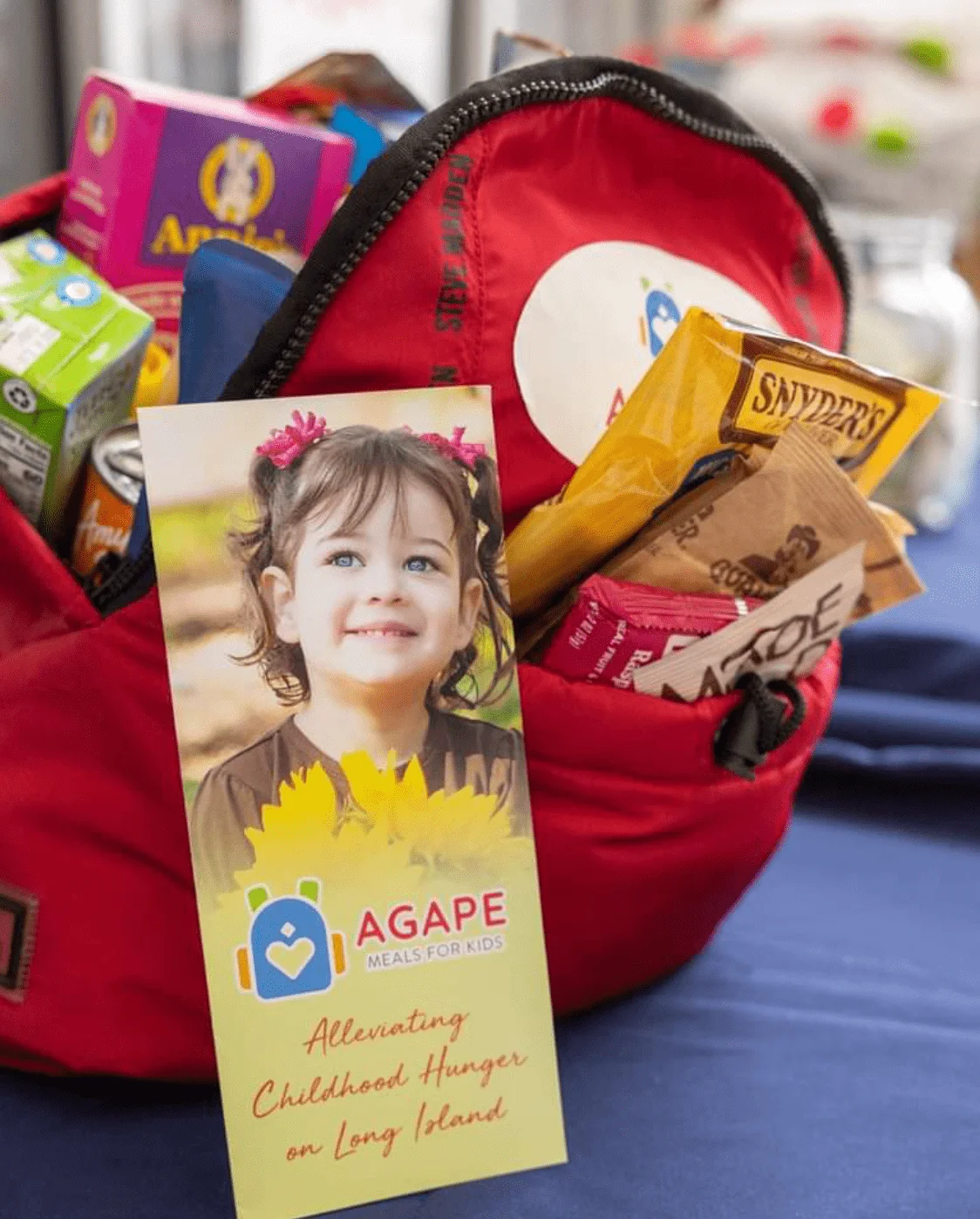 Agape Meals backpack with food items